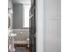 The bathroom features a pedestal sink, wainscoting, and a black door with a window at 131 N Sherman St, Denver, CO 80203
