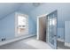 Bright bedroom featuring a large window with a view, light blue walls and gray carpeting at 131 N Sherman St, Denver, CO 80203