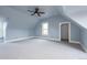 Spacious attic bedroom with large windows, neutral walls, and plush carpeting at 131 N Sherman St, Denver, CO 80203