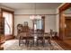 Bright dining room featuring wood trim, hardwood floors, chandelier, and seating for six at 131 N Sherman St, Denver, CO 80203