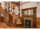 Charming space with ornate wood fireplace, a cozy chair, wood floors, and decorative trim at 131 N Sherman St, Denver, CO 80203