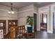 Landing area featuring wood trim, hardwood floors, vintage furnishings, and a faux tree in the corner at 131 N Sherman St, Denver, CO 80203