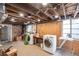Bright laundry room with modern washer and dryer, wood-paneled walls, and ample natural light at 131 N Sherman St, Denver, CO 80203