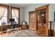 Bright office featuring wood trim, hardwood floors, large windows, desk, chair, and vintage furnishings at 131 N Sherman St, Denver, CO 80203