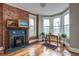 Office with hardwood floors, brick fireplace, and plenty of natural light from three windows at 131 N Sherman St, Denver, CO 80203