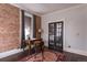 Bright office space with exposed brick, dark hardwood floors and classic french doors at 131 N Sherman St, Denver, CO 80203