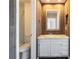 Rustic bathroom featuring a vanity and a toilet at 2314 S Troy St, Aurora, CO 80014