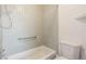 Bathroom showcasing a tub and toilet at 2314 S Troy St, Aurora, CO 80014