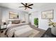 Cozy bedroom featuring neutral decor, ceiling fan, and ample space at 2314 S Troy St, Aurora, CO 80014