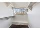 Walk-in closet with built-in shelving and hanging rods at 2314 S Troy St, Aurora, CO 80014