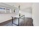 Bright dining room featuring hardwood floors, abundant natural light, and a modern light fixture at 2314 S Troy St, Aurora, CO 80014