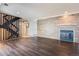 Inviting living room with a decorative fireplace, wood-look flooring, and comfortable seating at 2314 S Troy St, Aurora, CO 80014