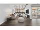 Bright living room featuring vaulted ceilings with skylights, hardwood floors, and modern furnishings at 2314 S Troy St, Aurora, CO 80014