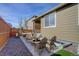 Inviting backyard with stone ground cover, a fire pit, and comfortable seating perfect for outdoor gatherings at 4238 S Netherland Cir, Aurora, CO 80013