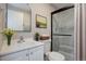 Bright bathroom features a glass shower, modern sink, and stylish decor for a clean and inviting space at 4238 S Netherland Cir, Aurora, CO 80013