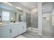 Bathroom featuring dual sinks and glass shower at 4238 S Netherland Cir, Aurora, CO 80013