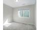 Neutral bedroom features a large window for natural light, and is completed with modern carpeting at 4238 S Netherland Cir, Aurora, CO 80013