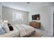 Main bedroom with large bed, dresser, and window at 4238 S Netherland Cir, Aurora, CO 80013