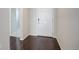 Clean entryway with dark hardwood flooring and a bright white front door at 4238 S Netherland Cir, Aurora, CO 80013