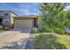 Home featuring a well-manicured lawn, concrete driveway, and attached two-car garage at 4238 S Netherland Cir, Aurora, CO 80013