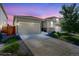 Charming home featuring a two-car garage, concrete driveway, and nicely landscaped front yard at 4238 S Netherland Cir, Aurora, CO 80013