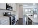 Modern kitchen with stainless steel appliances, quartz countertops, and subway tile backsplash at 4238 S Netherland Cir, Aurora, CO 80013