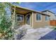 Charming outdoor patio offers ample space for relaxation and entertainment, with verdant foliage at 4238 S Netherland Cir, Aurora, CO 80013