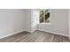 Finished basement room features a window and a door at 18815 W 93Rd Ave, Arvada, CO 80007