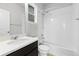 Clean bathroom with a shower-tub combination and a modern vanity at 18815 W 93Rd Ave, Arvada, CO 80007