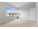 Bedroom with multiple windows offering a view of the neighborhood at 18815 W 93Rd Ave, Arvada, CO 80007