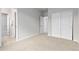 Neutral bedroom with plush carpeting, closet, and ensuite bathroom at 18815 W 93Rd Ave, Arvada, CO 80007