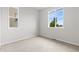 Neutral bedroom with wall-to-wall carpeting and two windows at 18815 W 93Rd Ave, Arvada, CO 80007