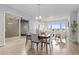 Dining area with wood floors, a sliding glass door and backyard views at 18815 W 93Rd Ave, Arvada, CO 80007