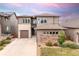 Attractive home with a three-car garage, complementary color palette, and a well-kept lawn at 18815 W 93Rd Ave, Arvada, CO 80007