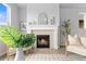 Living room showcasing a fireplace with mantle and stone surround at 18815 W 93Rd Ave, Arvada, CO 80007