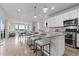 Spacious kitchen with bar seating that overlooks the dining and living area at 18815 W 93Rd Ave, Arvada, CO 80007