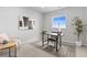 Bright home office with desk, modern art, and a large window at 18815 W 93Rd Ave, Arvada, CO 80007