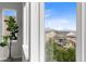 A view of the neighborhood and mountains can be seen through the window at 18815 W 93Rd Ave, Arvada, CO 80007