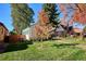 Backyard view with grass and fall foliage at 1275 Birch St, Denver, CO 80220