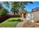 Spacious backyard with a wooden fence and shed at 1275 Birch St, Denver, CO 80220