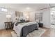 Cozy bedroom featuring soft lighting, comfortable bedding, and stylish decor at 1275 Birch St, Denver, CO 80220