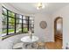 Cozy dining area featuring a round table, modern chairs, large windows with natural light at 1275 Birch St, Denver, CO 80220