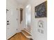 Inviting foyer with hardwood floors, white walls, and architectural details adding character and charm at 1275 Birch St, Denver, CO 80220