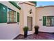Charming home with a brick entrance and green trim with number 1275 on door at 1275 Birch St, Denver, CO 80220