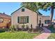 Charming home with a lush front yard, brick walkway at 1275 Birch St, Denver, CO 80220