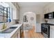 Charming kitchen with marble backsplash, stainless steel appliances, and eat in kitchen nook at 1275 Birch St, Denver, CO 80220