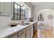 Charming kitchen with marble backsplash, stainless steel appliances, and eat in kitchen nook at 1275 Birch St, Denver, CO 80220