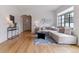Open-concept living room with hardwood floors, stylish decor, and plenty of natural light at 1275 Birch St, Denver, CO 80220