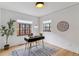 Bright office space with large windows, a modern desk, and neutral decor at 1275 Birch St, Denver, CO 80220