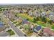 Beautiful aerial view of a neighborhood with well-maintained homes, green spaces, and lush landscaping at 6343 Laguna Cir, Highlands Ranch, CO 80130